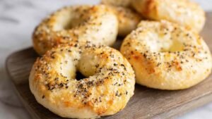 Cottage cheese bagels high protein golden brown on baking sheet with everything seasoning