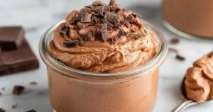 Protein pudding in glass bowl showing creamy texture with protein powder and Greek yogurt