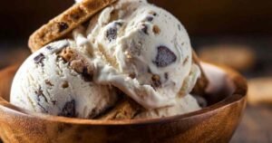 Cookies and cream protein ice cream scooped in bowl showing creamy texture with cookie pieces