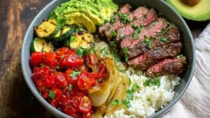 High protein steak fajita bowl with chipotle marinated steak and cauliflower rice