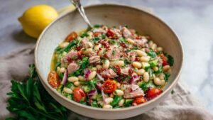Tuna White Bean Salad with lemon dressing, parsley, and sun-dried tomatoes (high protein)