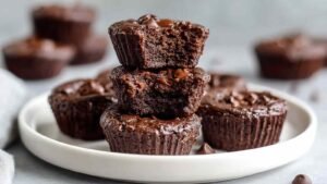 Flourless chocolate protein brownie bites cooling on wire rack showing fudgy texture