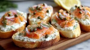 Smoked salmon cottage cheese crostini arranged on white serving platter with dill garnish