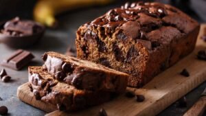 High protein gluten free banana bread sliced on cooling rack showing moist texture