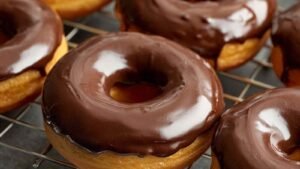 High protein chocolate donuts recipe showing finished donuts on cooling rack