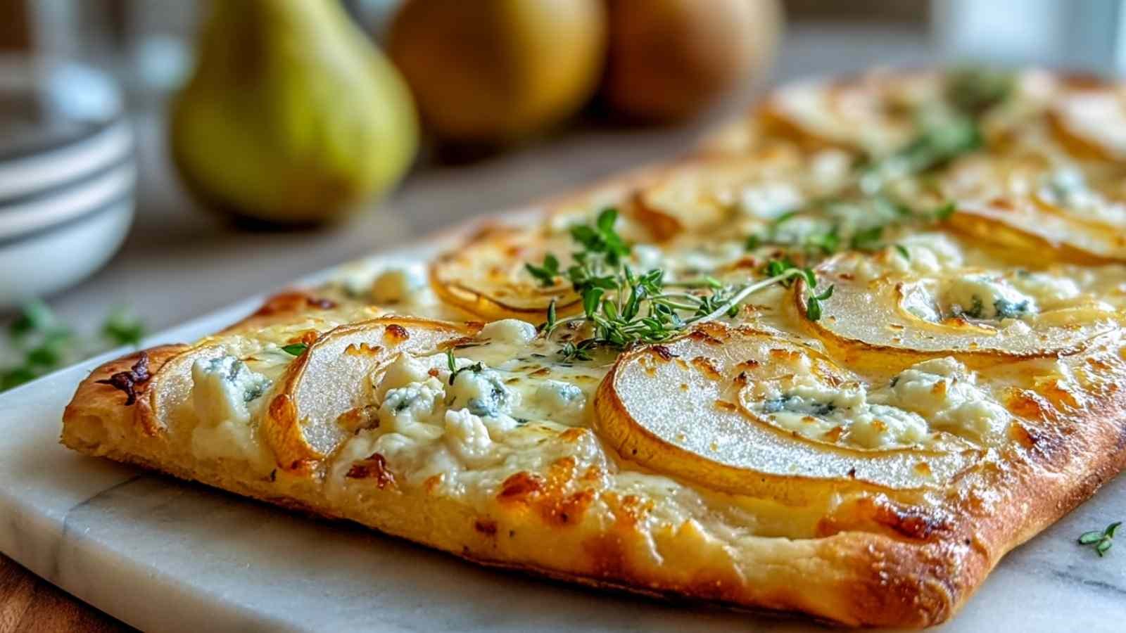 Pear and Gorgonzola Flatbread topped with honey, walnuts and arugula on wooden board